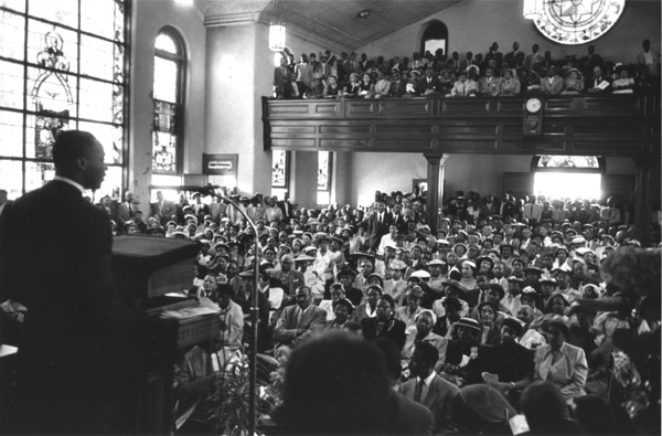Martin Luther King, Jr. speaking in church during the Montgomery bus boycott.